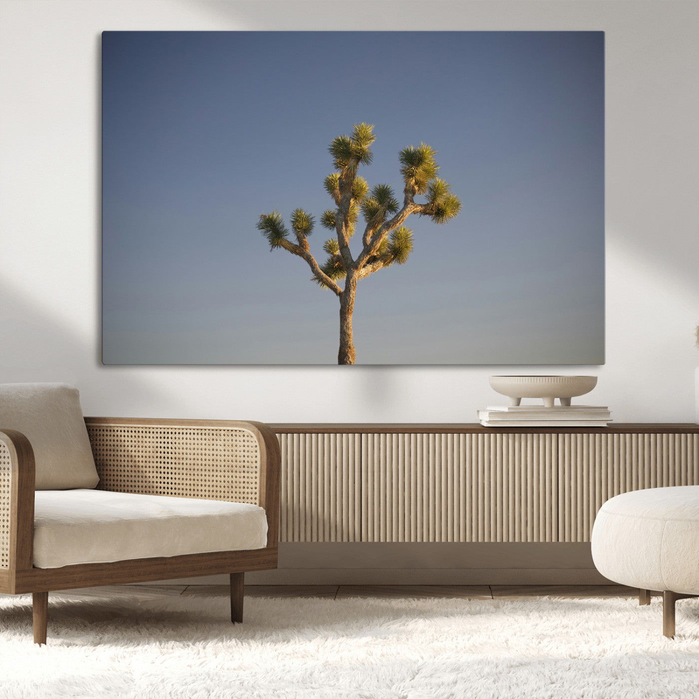A lone Joshua Tree standing against a deep blue sky, capturing the serene and rugged beauty of the Southwestern desert landscape.