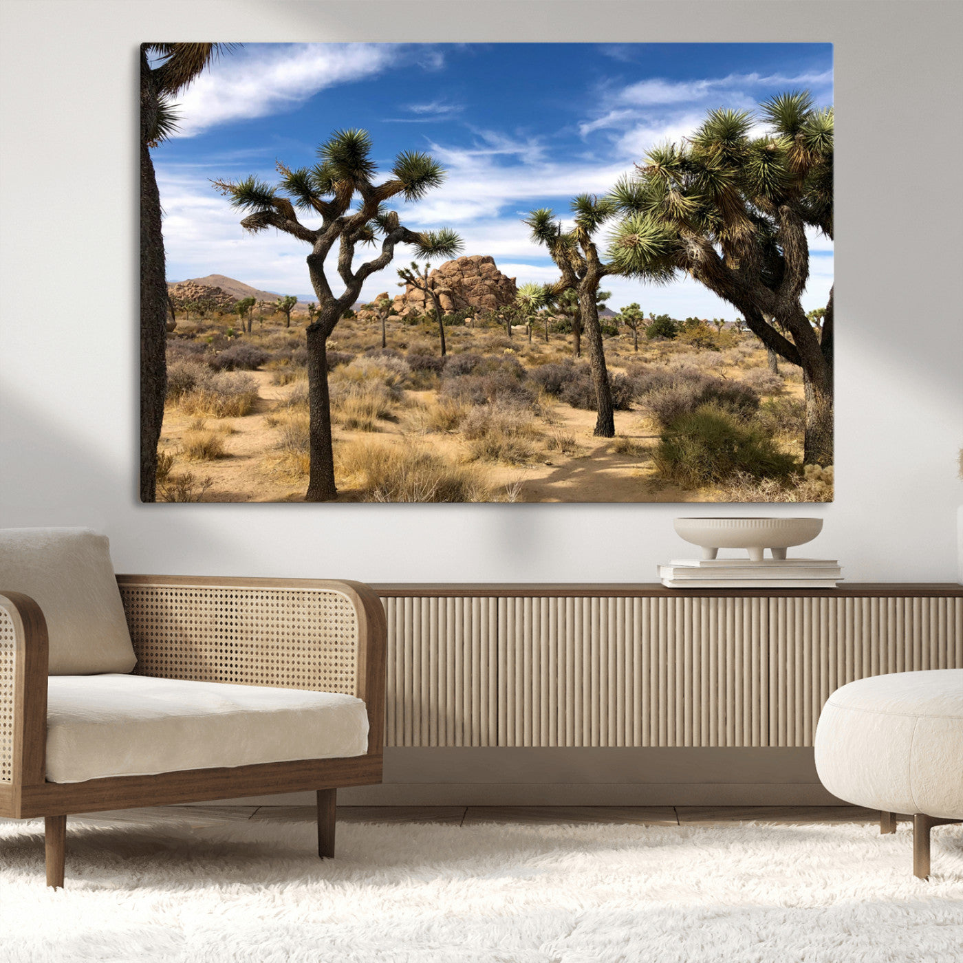 Scenic Joshua Tree landscape with rugged desert terrain, golden dry grass, and a deep blue sky, creating a warm, rustic Southwestern aesthetic.