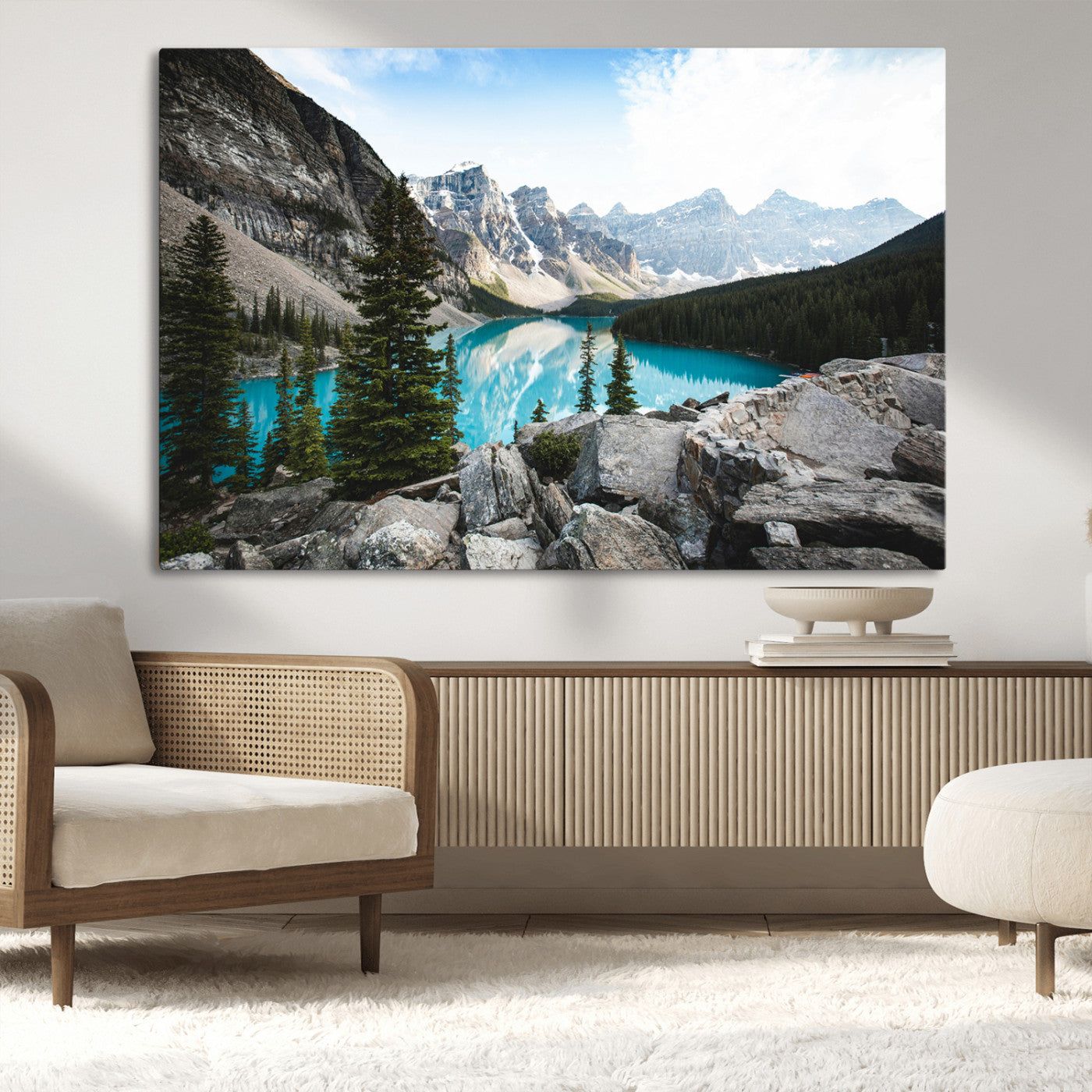Stunning view of Moraine Lake with turquoise waters reflecting snow-capped mountains and evergreen trees, creating a peaceful alpine decor.