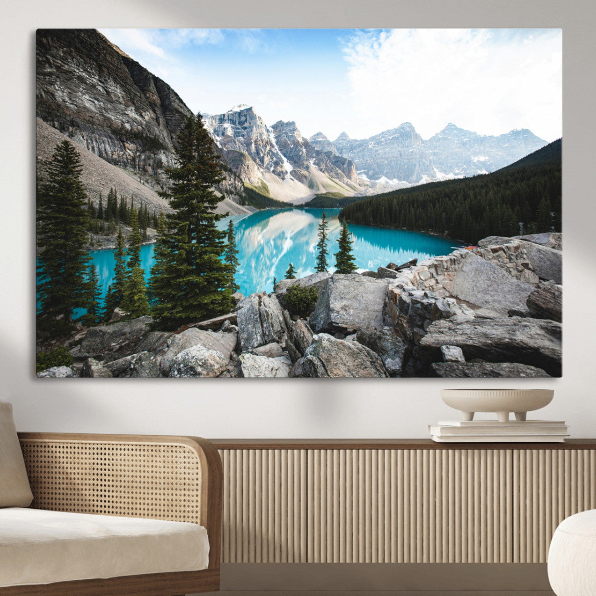 Stunning view of Moraine Lake with turquoise waters reflecting snow-capped mountains and evergreen trees, creating a peaceful alpine decor.