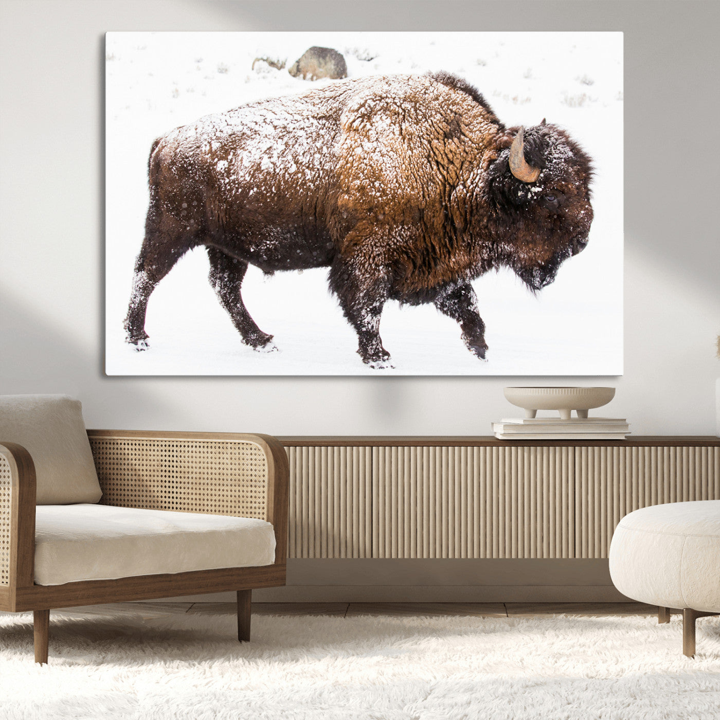 Side profile of a powerful bison walking through deep snow, with frost-covered fur and a white winter background, perfect for rustic and western decor.