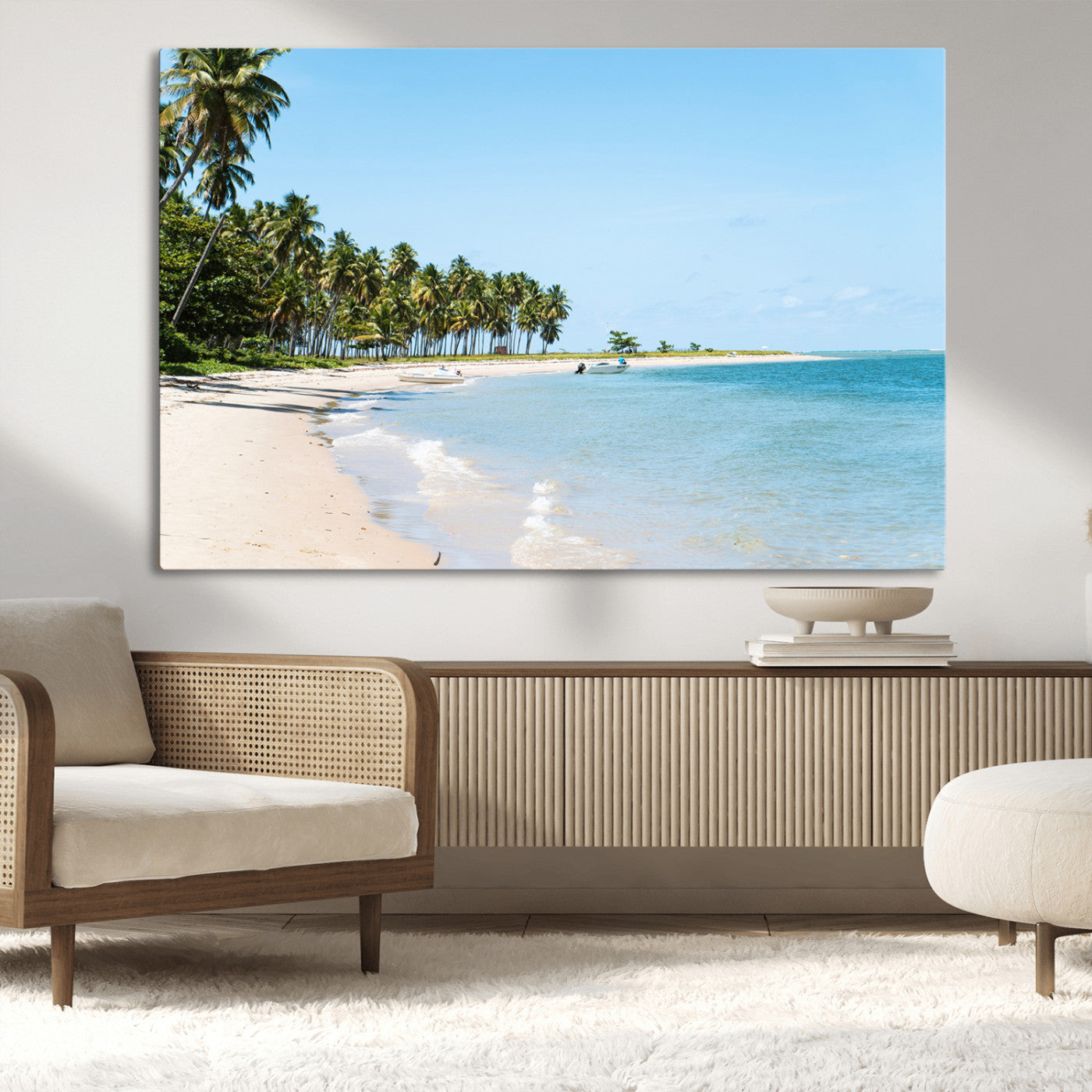 A serene tropical beach with clear blue water, soft sand, and lush palm trees under a bright sky, creating a peaceful island paradise atmosphere.