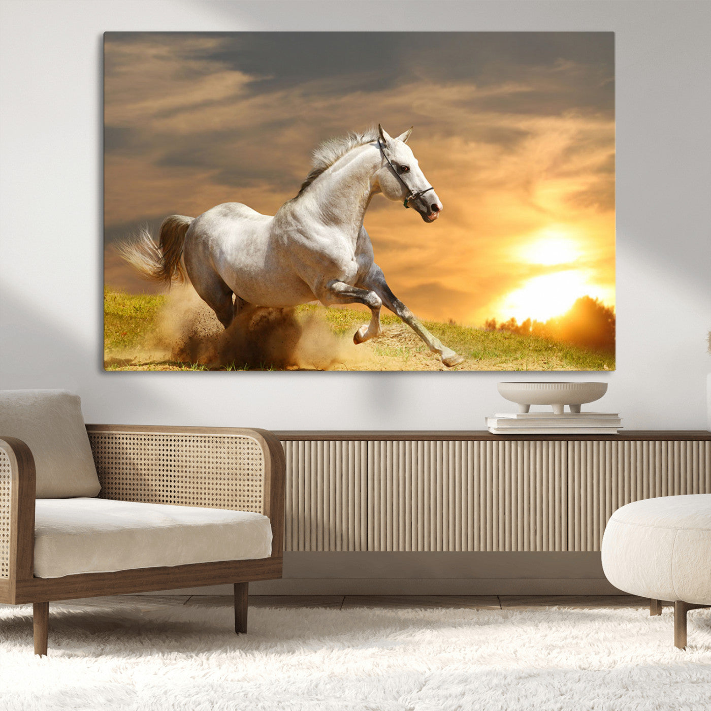 A powerful white horse galloping through the field at sunset, with the golden light illuminating its mane and the vibrant sky in the background.