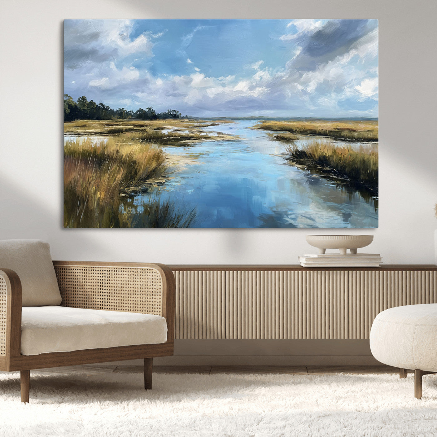 A beautiful, painterly landscape of a calm river winding through a marsh, with vibrant green grasses and a bright blue sky filled with fluffy clouds.