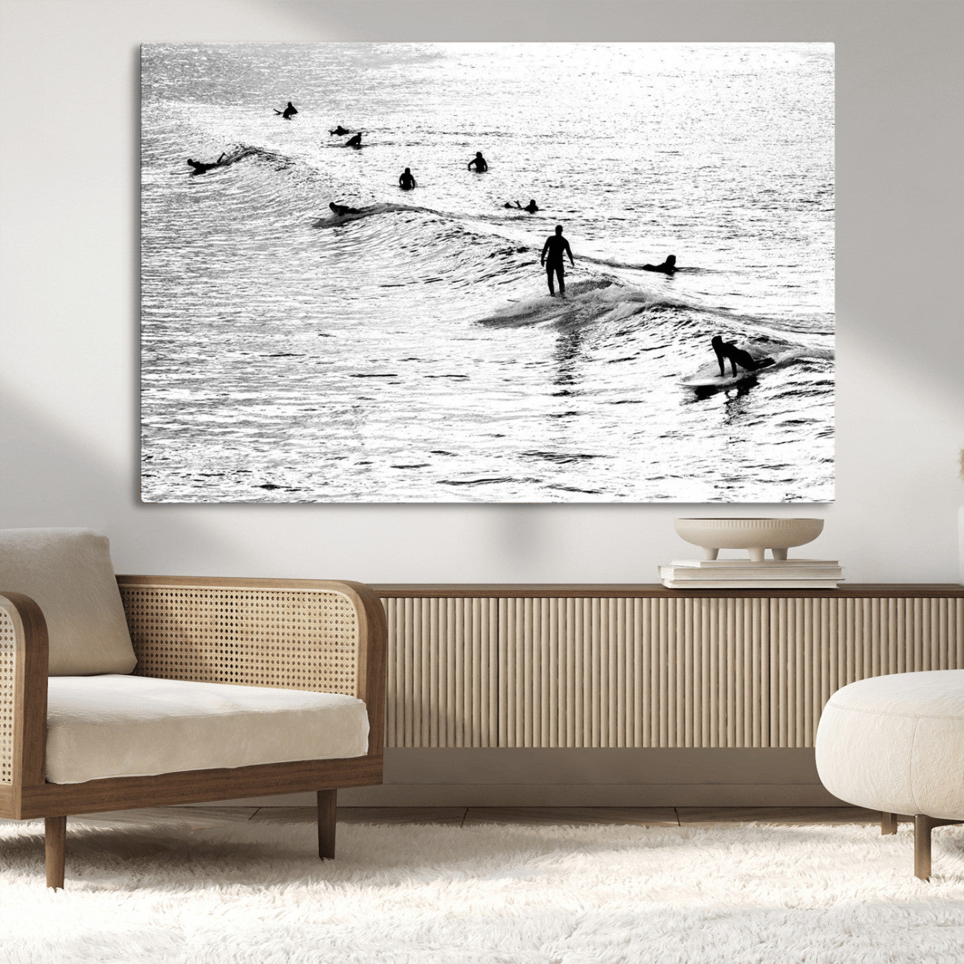 19970637-MGV-CV-36X24-Black and white artistic view of surfers riding and paddling on waves in the ocean, capturing the dynamic motion and energy of surfing