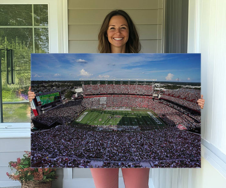 The wall art is a South Carolina Gamecocks print, showcasing Williams-Brice Stadium from a distance under clear skies.