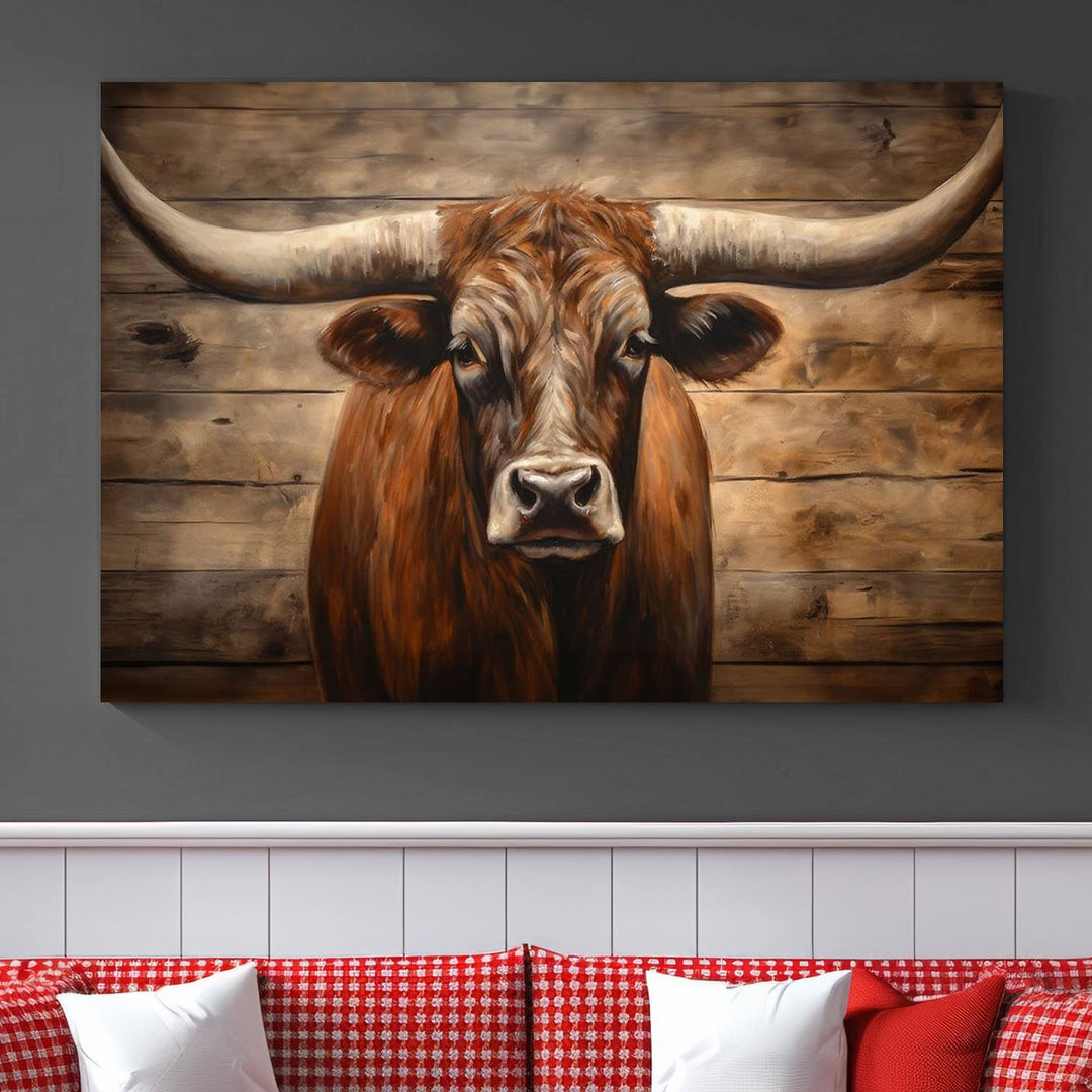 The Longhorn Bull Wall Art, a ready-to-hang canvas print, showcases an image of a brown longhorn cow set against a wooden background, perfect for those looking to enhance their space with rustic farmhouse and western barn decor.