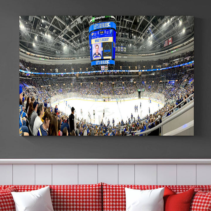 Wall art prints depicting the bustling scenes of the St. Louis Blues being cheered on by a full house at the Enterprise Center, beneath a large scoreboard.