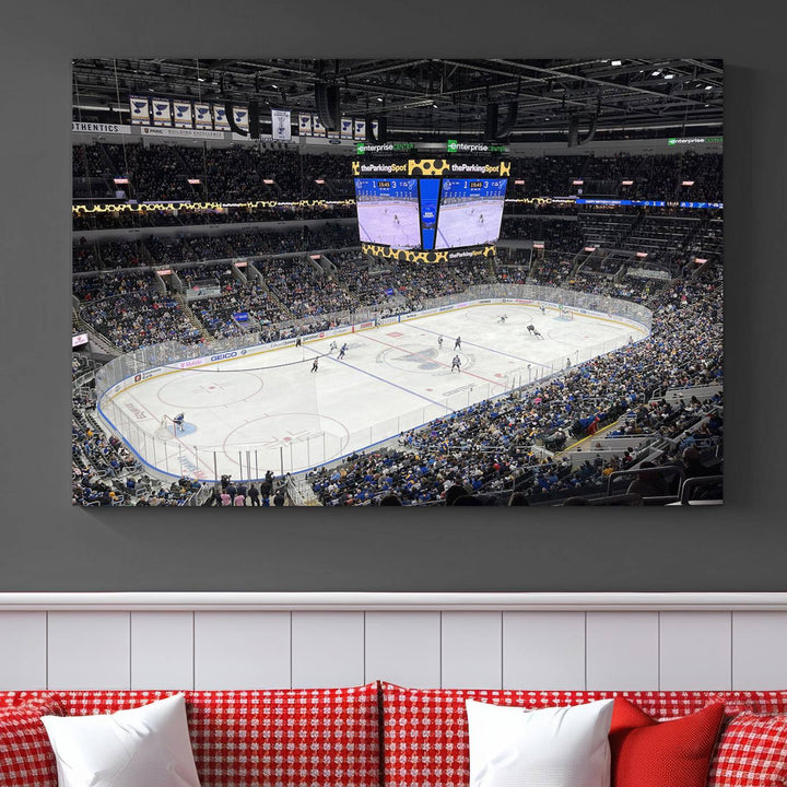 A large Enterprise Center canvas of a crowded hockey arena hangs prominently.