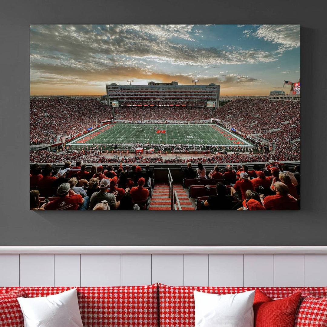 The living room features a stunning triptych of Lincoln Memorial Stadium wall art canvas print, celebrating the University of Nebraska Cornhuskers football team. This piece serves as captivating wall art, showcasing a gallery-quality finish.