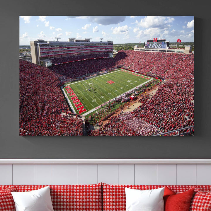 The University of Nebraska Cornhuskers Football Team Print showcases a vibrant triptych of Lincoln Memorial Stadium, depicting a packed football stadium filled with energetic fans. This handmade art piece is crafted in the USA and printed on premium canvas for a gallery-quality finish.