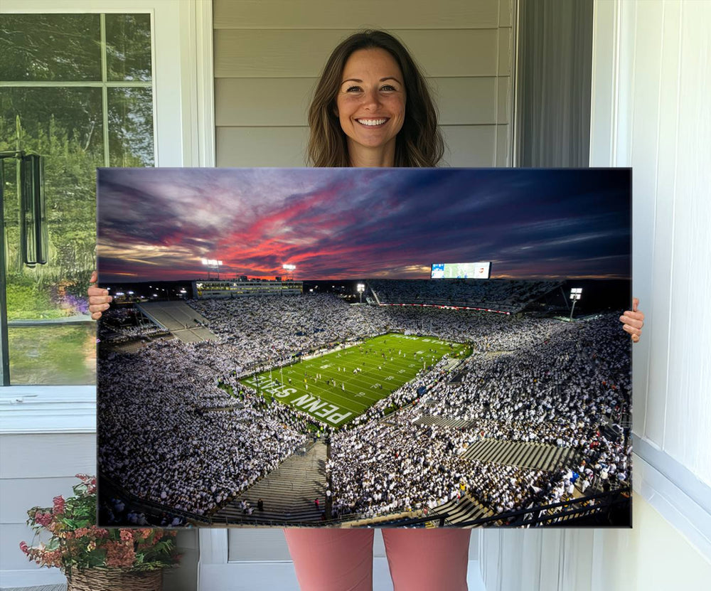 A sunset print on a canvas wall art piece captures the scene of white-clad fans at Beaver Stadium for the Nittany Lions game.