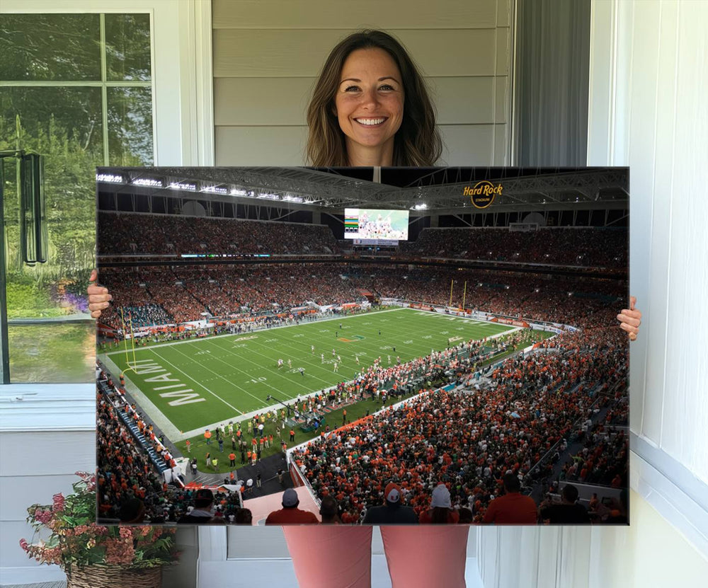 Aerial view of a Miami Hurricanes game at Hard Rock Stadium captured on canvas print, showcasing the teams on the field and fans in the stands.