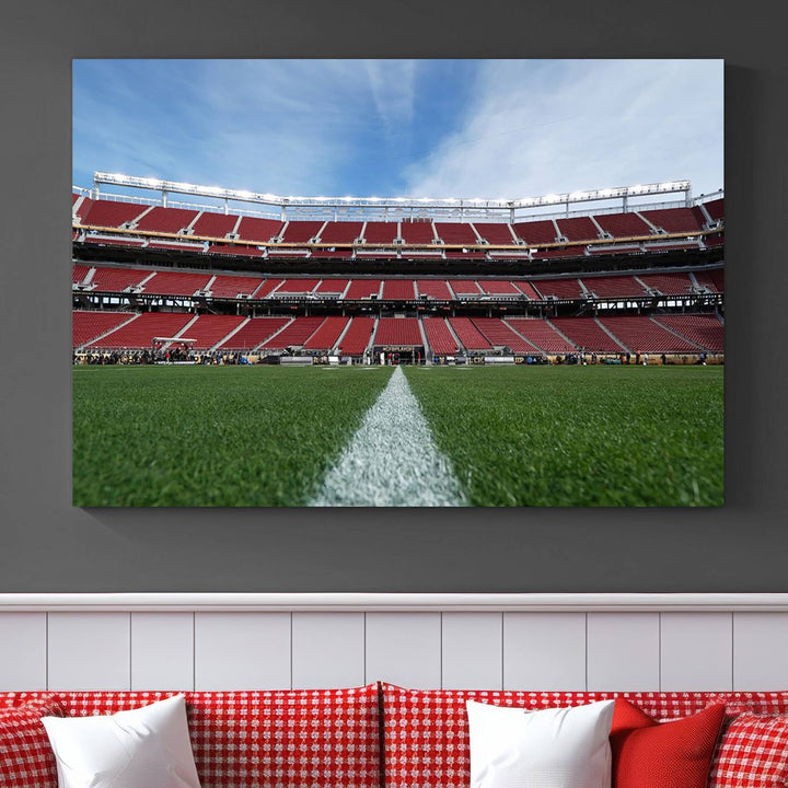 A canvas print of the University of Tulsa Golden Hurricane showcases H.A. Chapman Stadiums football field and red seats against a backdrop of a blue sky.