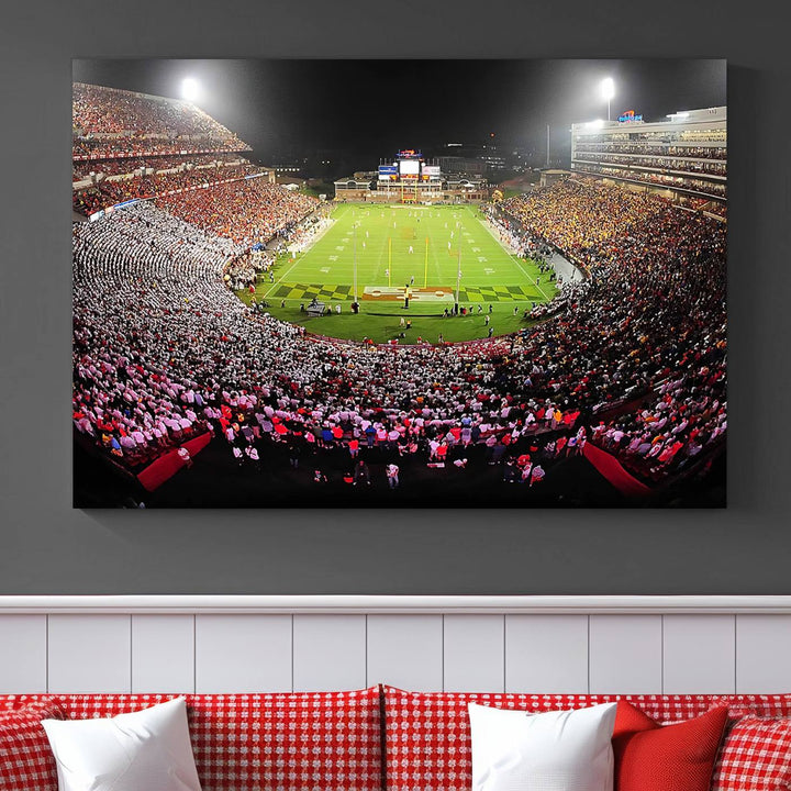 The Maryland Terrapins Football Wall Art Canvas showcases a packed SECU Stadium at night with a bright field and cheering fans.