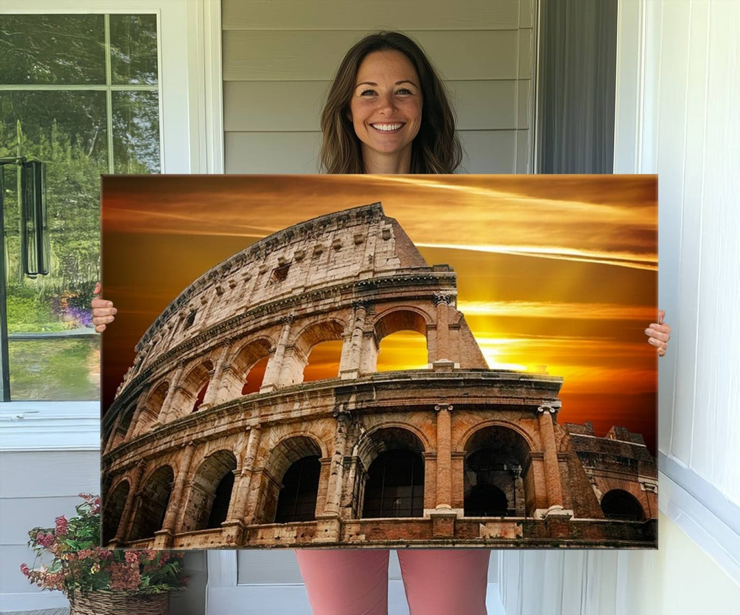 On the wall, theres a piece of art titled Colosseum with Yellow Sunset Behind, Italy.