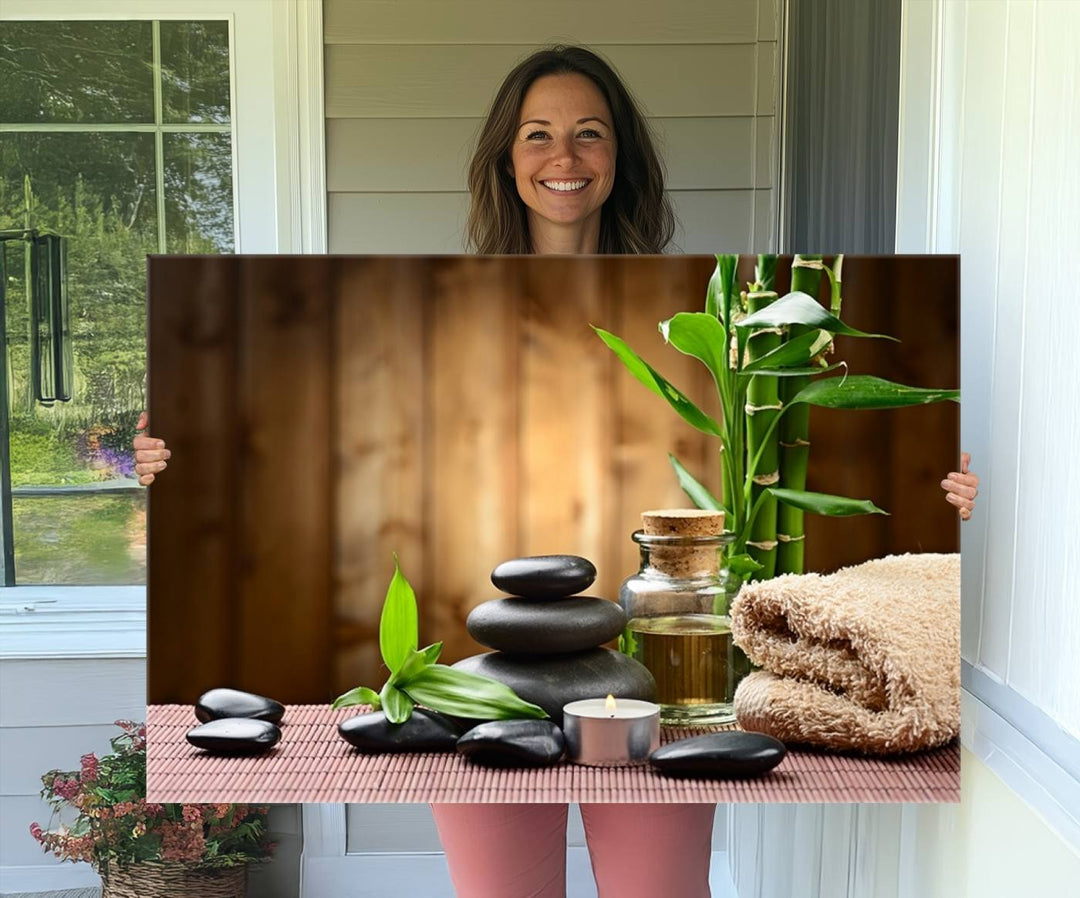 Zen Serenity Triptych Canvas Art: Pink Lotus Flower and Stones, Tranquil Water Lily Print, creating a peaceful spa ambiance.