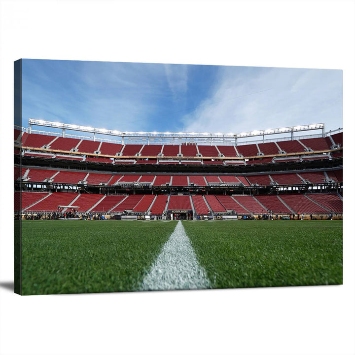 A canvas print of the University of Tulsa Golden Hurricane showcases H.A. Chapman Stadiums football field and red seats against a backdrop of a blue sky.