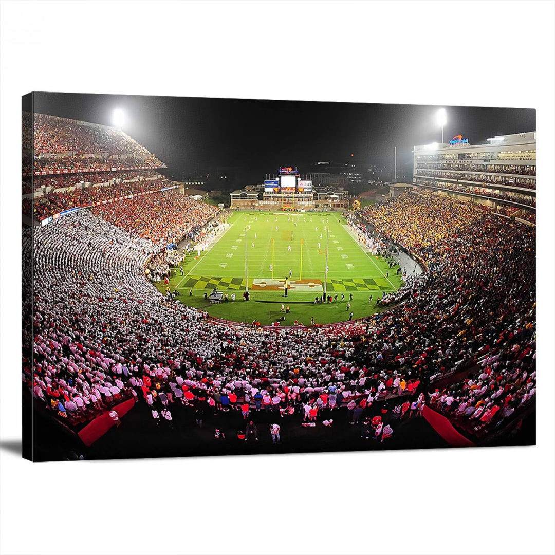 The Maryland Terrapins Football Wall Art Canvas showcases a packed SECU Stadium at night with a bright field and cheering fans.