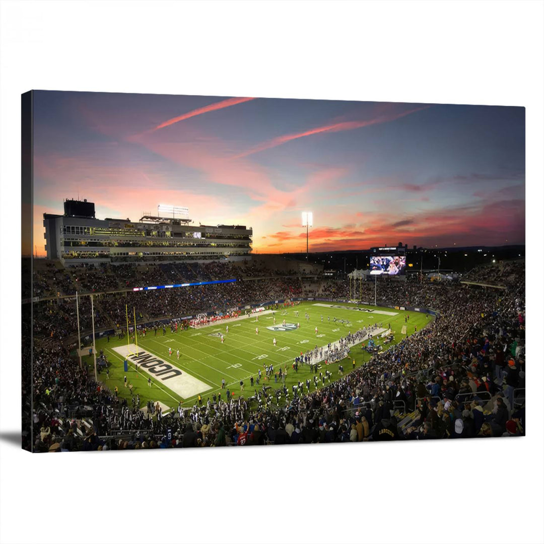 This wall art canvas print captures UCONN Huskies fans energizing a sunset scene at East Hartfords Pratt & Whitney Stadium.