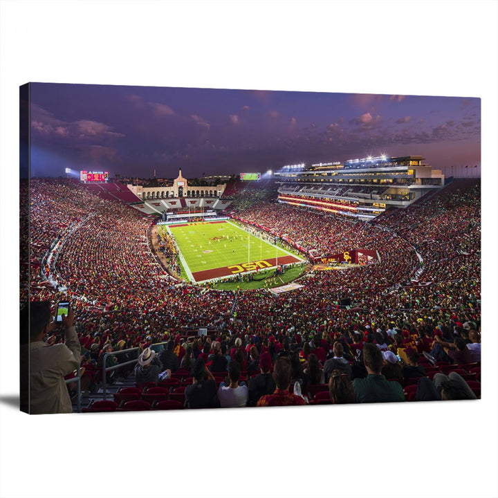 The vibrant wall art canvas print captures the USC Trojans playing under lights at dusk in LA Memorial Coliseum.