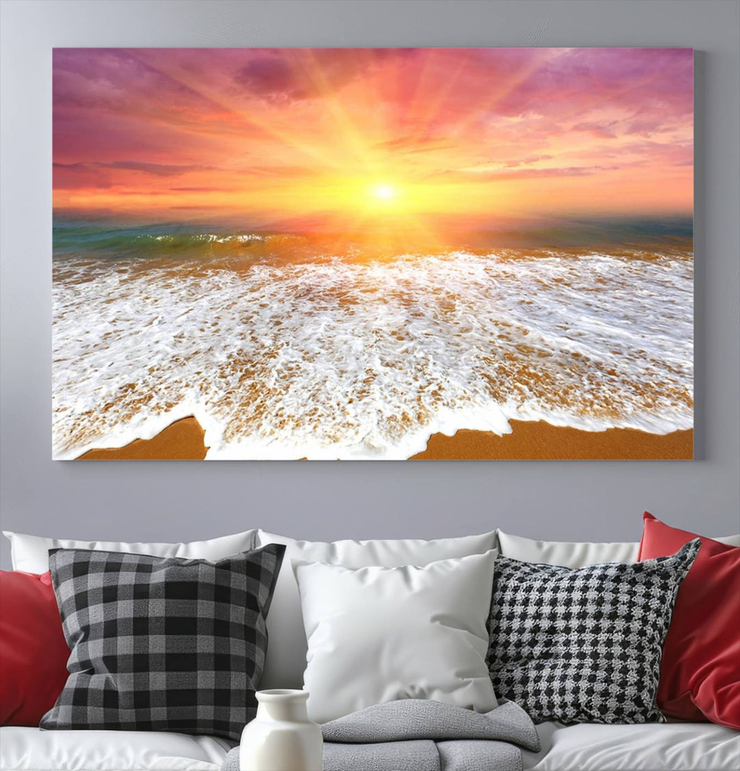 Golden Beach Sunrise 3-panel canvas art of ocean waves, hung on a wooden wall.