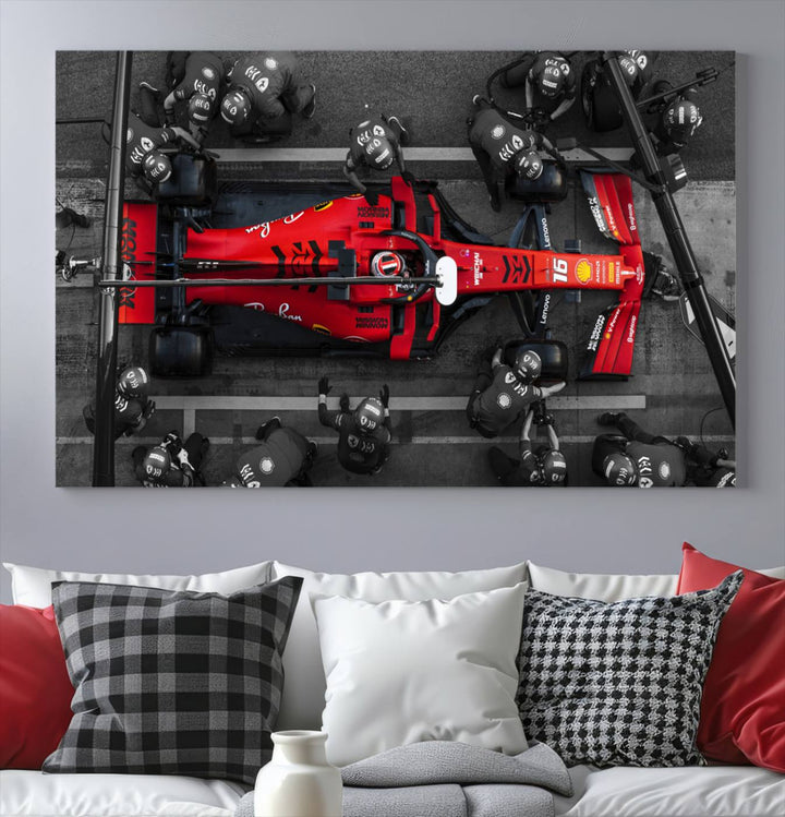 The Ferrari Pit Stop Canvas Wall Art features bold motorsport imagery that captures the precision and speed of Formula 1.