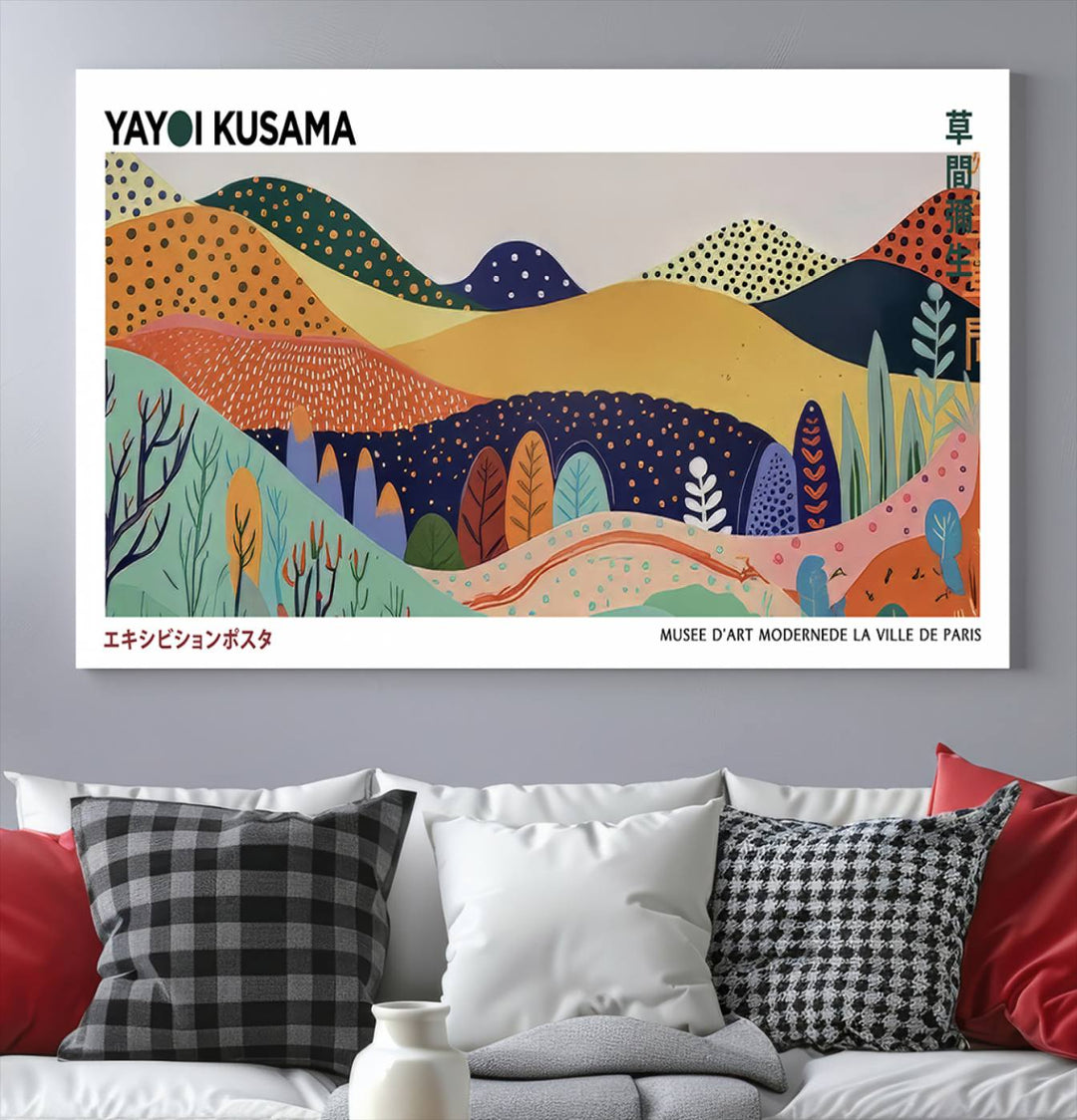 A Yayoi Kusama abstract landscape print adorns the wall.