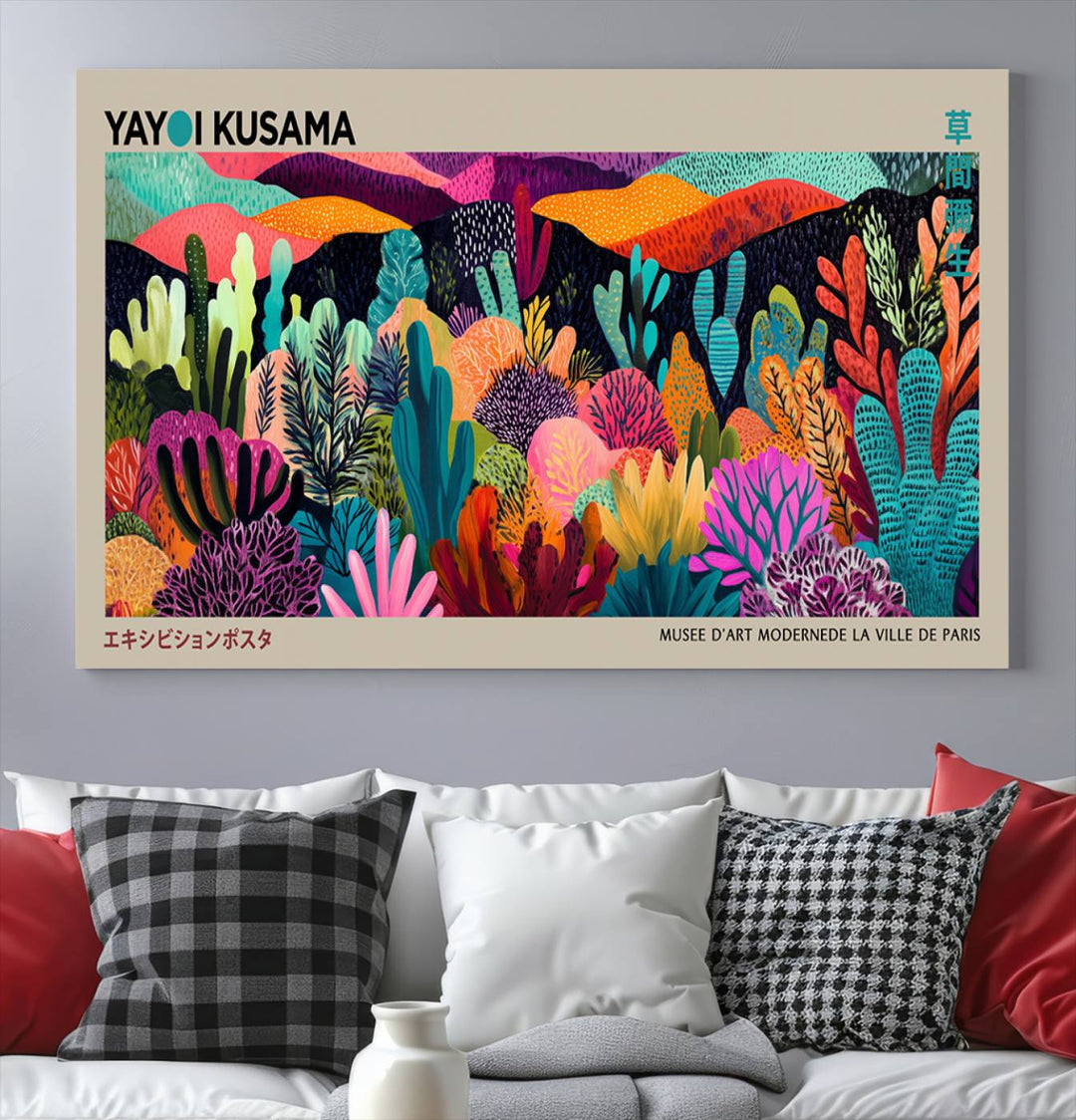 The framed Yayoi Kusama wall art adds vibrancy above the blue couch.