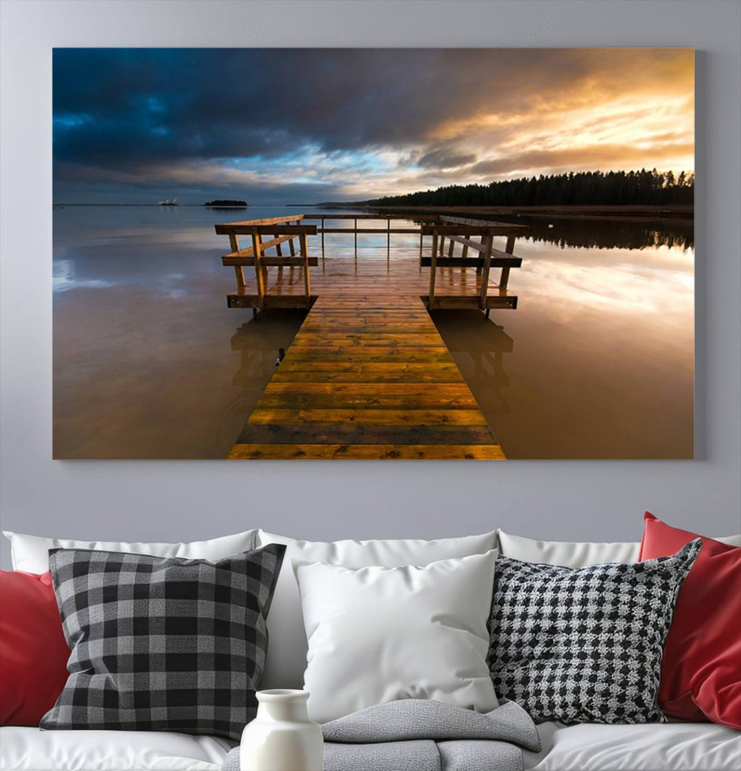 The "Serene Lake Pier at Sunset" landscape canvas print, crafted as ready-to-hang and framed wall art, enriches the contemporary setting by capturing the tranquility of a lakeside pier at sunset.