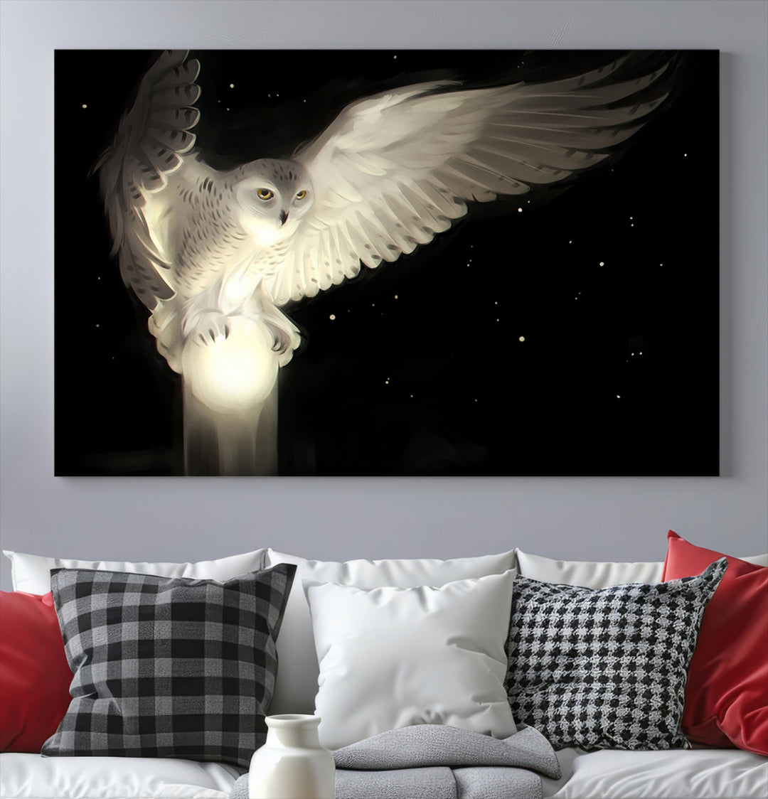 The Night Owl Art graces the wall with its depiction of a snowy owl on a glowing orb, perfect for modern decor.