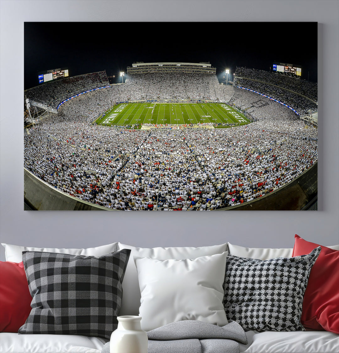 The Beaver Stadium Night Game Triple Canvas Wall Art - Penn State Nittany Lions Football Match features a panoramic view of a packed Beaver Stadium at night.