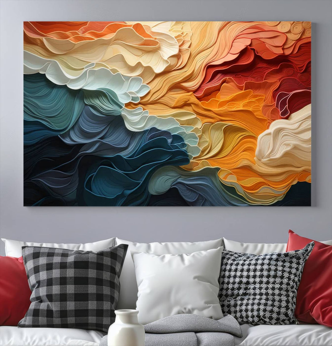 A Blue Orange Abstract Wave Wall Art Canvas Print adorns the wall. This colorful masterpiece is professionally hand-assembled to enhance any space.