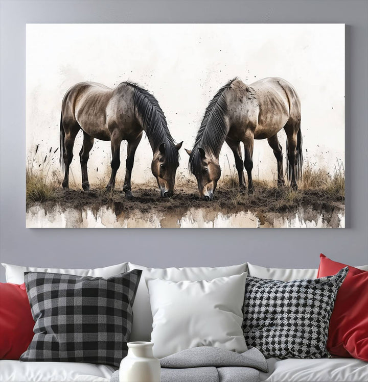 A Chinese Ink Style Horses Wall Art Canvas Print featuring two horses grazing is displayed in a modern setting.