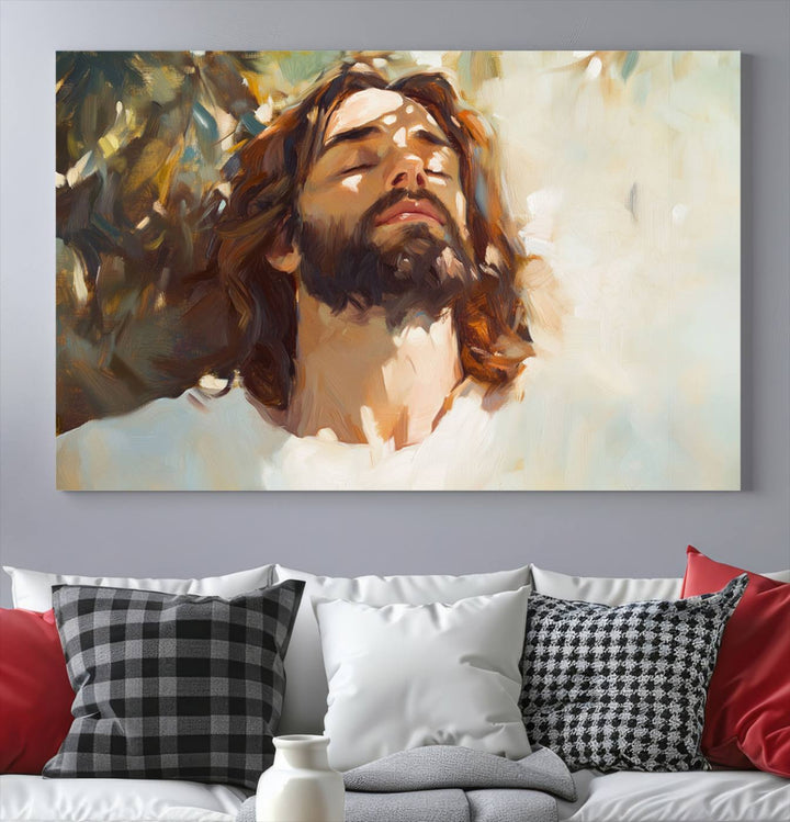 The Jesus Portrait Wall Art Canvas Print features a depiction of Jesus Christ with closed eyes, basking in sunlight. His expression exudes a peaceful, spiritual atmosphere against a blurred background.