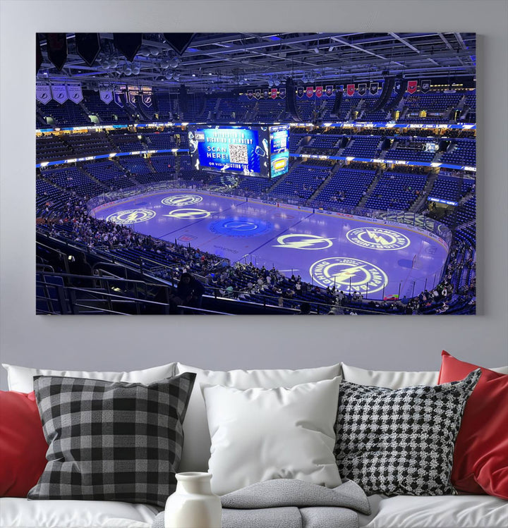 The wall art canvas print at Amalie Arena features team logos on ice, encapsulating the vibrant atmosphere of an NHL hockey stadium.