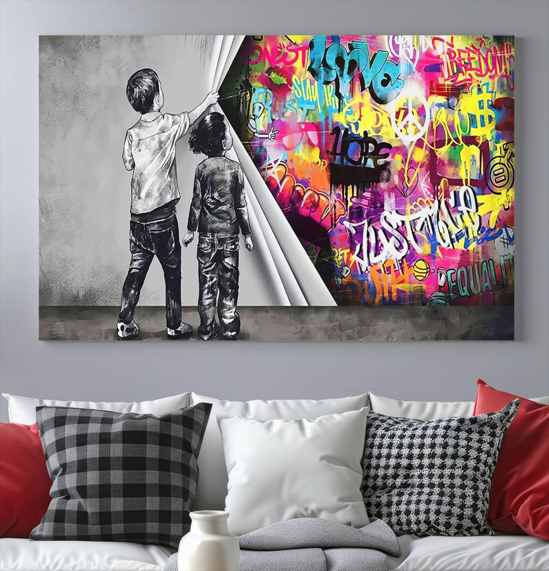 The Banksy Print - Street Art Canvas features a vibrant and bold image of two children lifting a curtain to reveal colorful graffiti. It's ready to hang, adding an urban modern decor vibe.