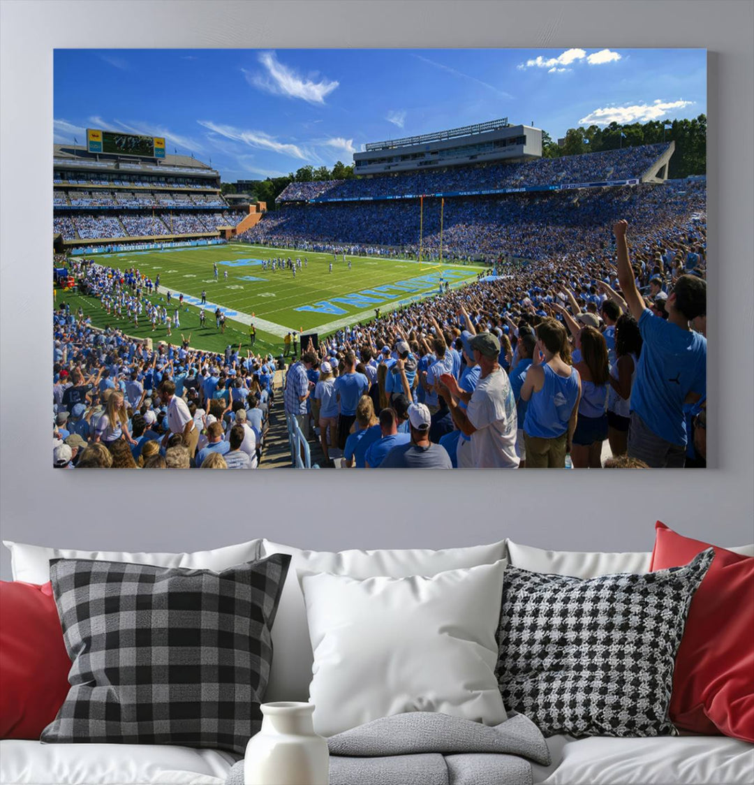 A gallery-quality canvas wall art print featuring the University of North Carolina Tar Heels Football Team and Chapel Hill's Kenan Memorial Stadium adorns the cafe wall.