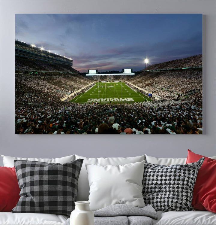 Wall art featuring a stadium at dusk with full stands—ideal for the Michigan State Spartans Football Team Canvas Print.