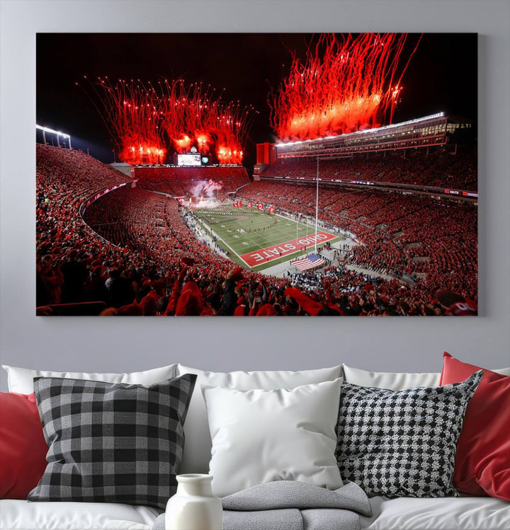 A vibrant red canvas art of a packed Ohio State Buckeyes stadium at night with fireworks.