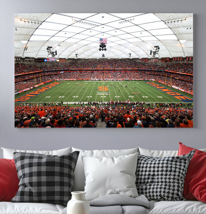 Fans fill the Syracuse JMA Wireless Dome, highlighted in orange and blue under a vaulted roof on this premium canvas print of the scene.