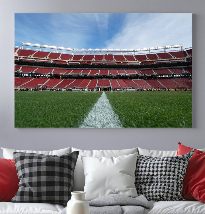 A canvas print of the University of Tulsa Golden Hurricane showcases H.A. Chapman Stadiums football field and red seats against a backdrop of a blue sky.