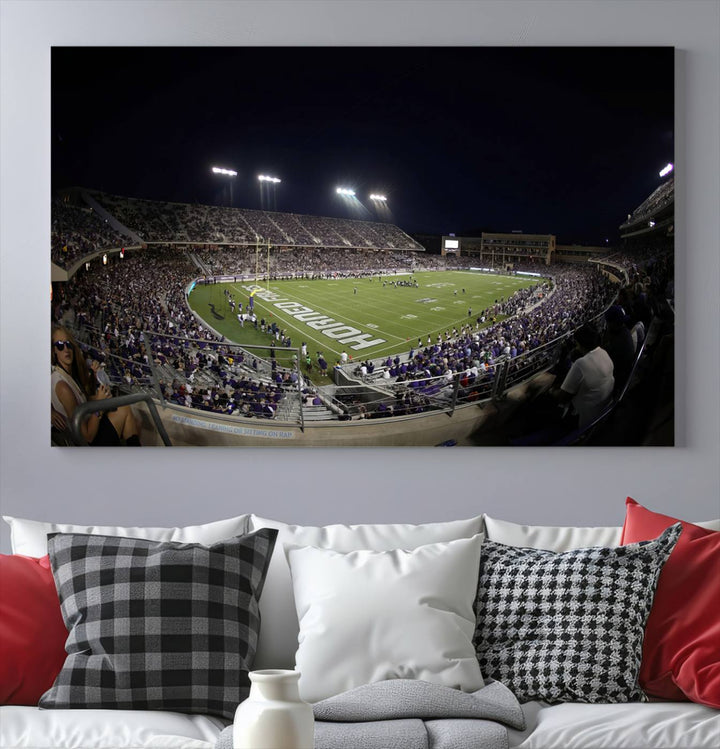 The wall art print features a night view of Amon G. Carter Stadium filled with TCU fans, showcased in the Horned Frogs Football Canvas Wall Art.