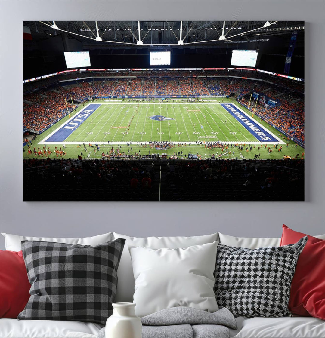 The UTSA Roadrunners game at Alamodome canvas print captures the scene from above, displaying fans and the UTSA lettering on the field.