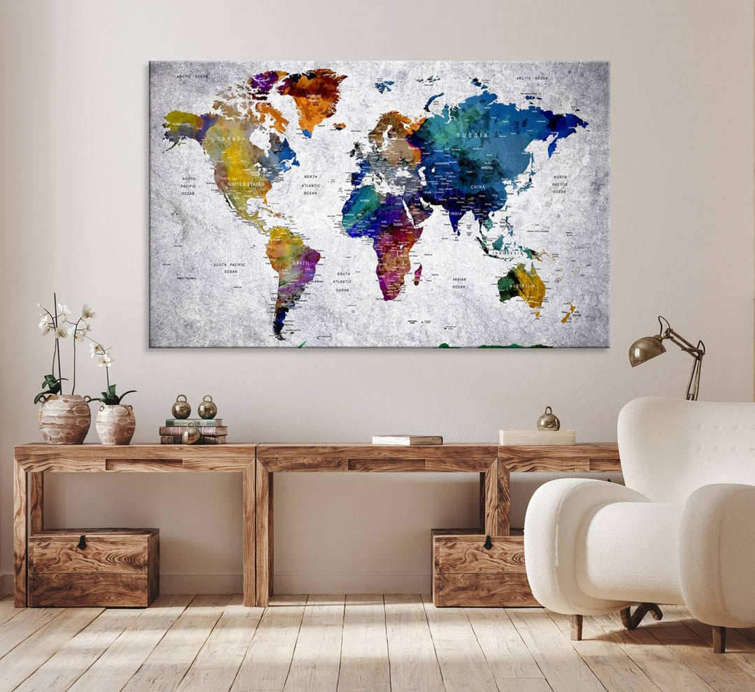 The World Map Art Canvas Print, featuring country names on a grunge-stained gray background, is perfect for stylish home decor.