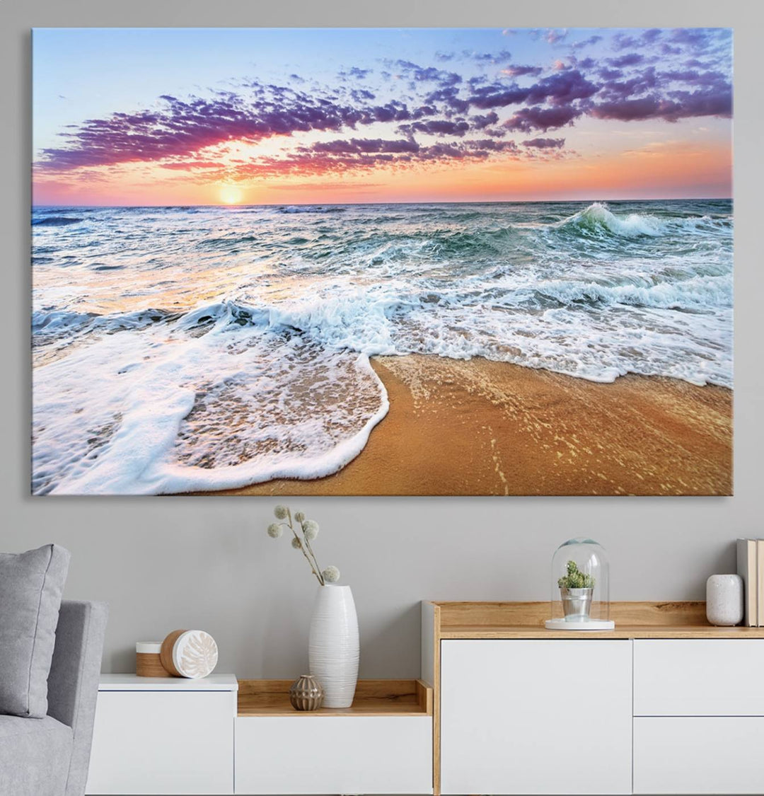 The Tropical Beach Waves Art Print, depicting an ocean sunset and sandy shore, enriches the coastal decor of the dining area.