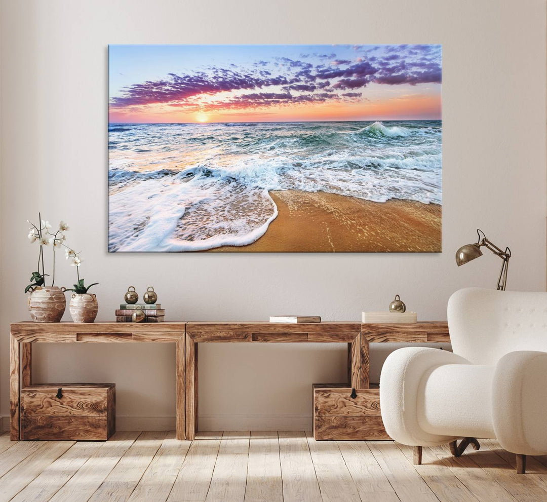 The Coastal Sunset Art Canvas Print features ocean waves beneath a vibrant sky in a stunning 3-panel seascape.