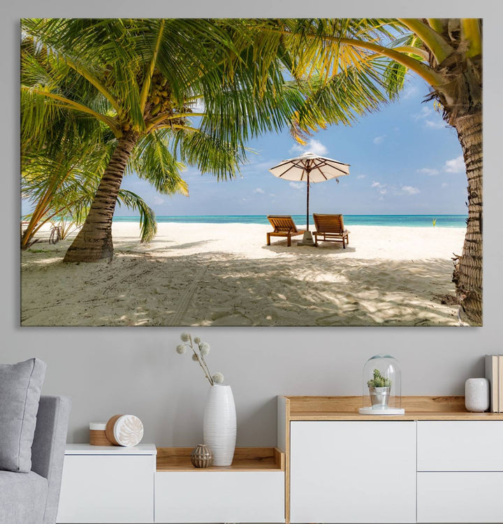 The canvas art print titled Lounge Chairs Palm Trees on Tropical Beach offers free shipping.