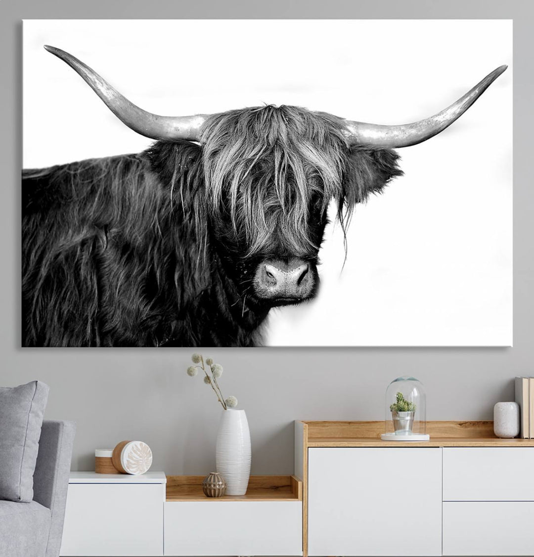 The Black and White Highland Cow Multi Panel Wall Art Canvas Print with UV-protection hangs prominently.