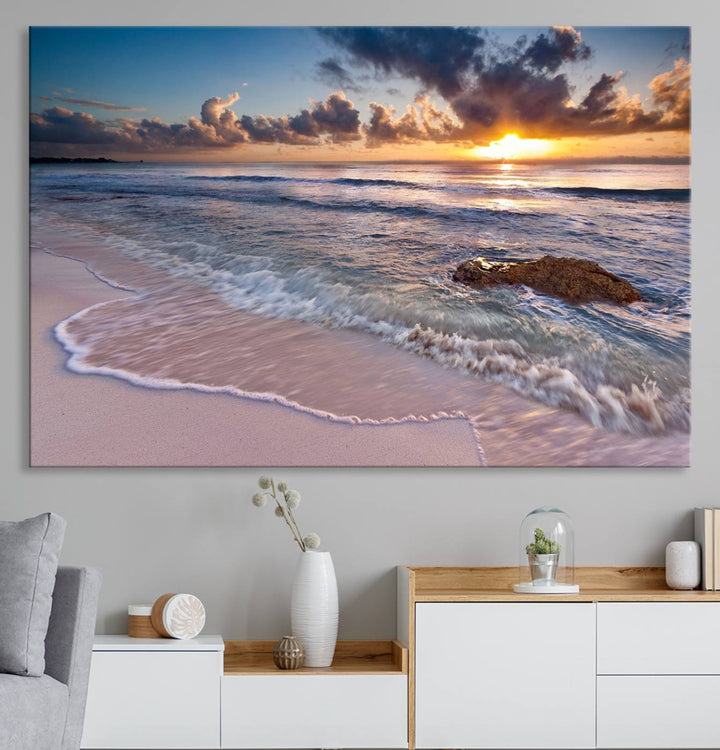 The room features a Sunset Beach Waves Canvas above the counter.